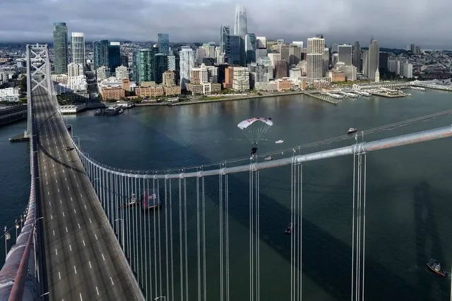Photos: Skysurfer Sean MacCormac Completes ‘World’s First Skysurf And Grind Across A Bridge’ In San Francisco