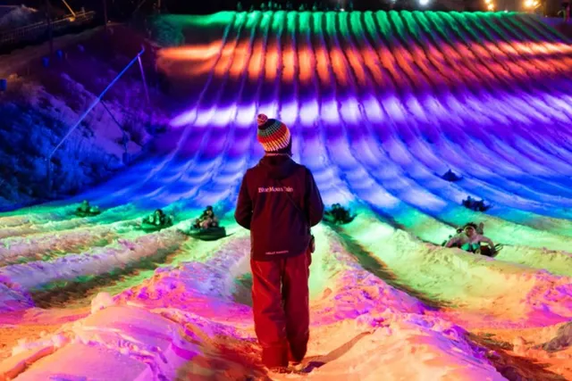 The Country’s Largest Snow Tubing Resort Is Just 2 Hours From NYC – With 56 Lanes, Light Shows, Après Lounges & More