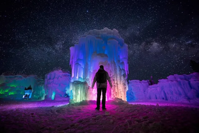 This Otherworldly ‘Frozen’ Kingdom Is One Of The Best Winter Escapes in the U.S. — With Aurora-Like Caverns, An Ice Bar, & A Mystic Light Walk