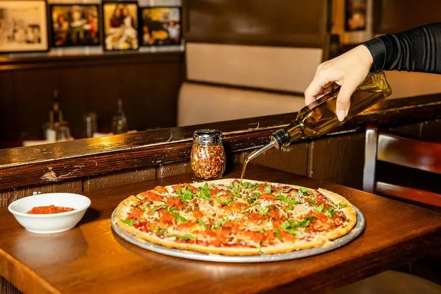 This Historic 1932 Chicago Pizzeria Just Partnered With A Celebrity-Owned Café To Launch A Special Plant-Based Pie