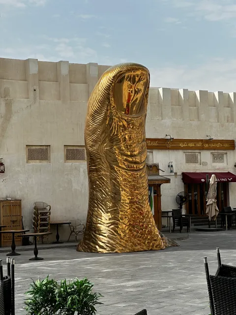 The Golden Thumb Statue