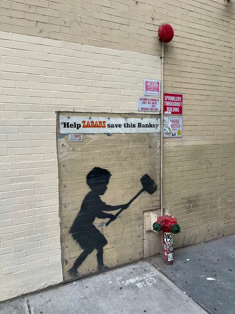 Banksy "Hammer Boy" Mural