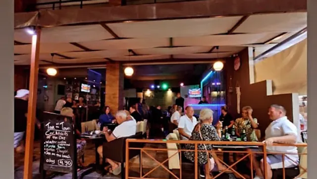 Talk of the Town Cocktail/Karaoke Bar & Beach Front Apartments