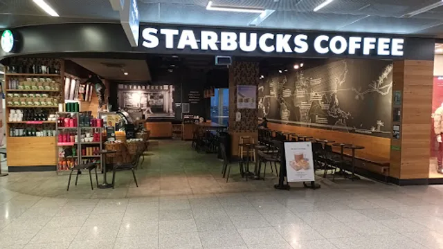 Starbucks Abflug Terminal B Ebene 3 (Öffentlicher Ebene)