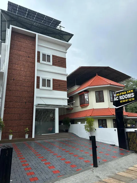 Hotel Alpha Inn Bystander Accommodation near Rajagiri Hospital