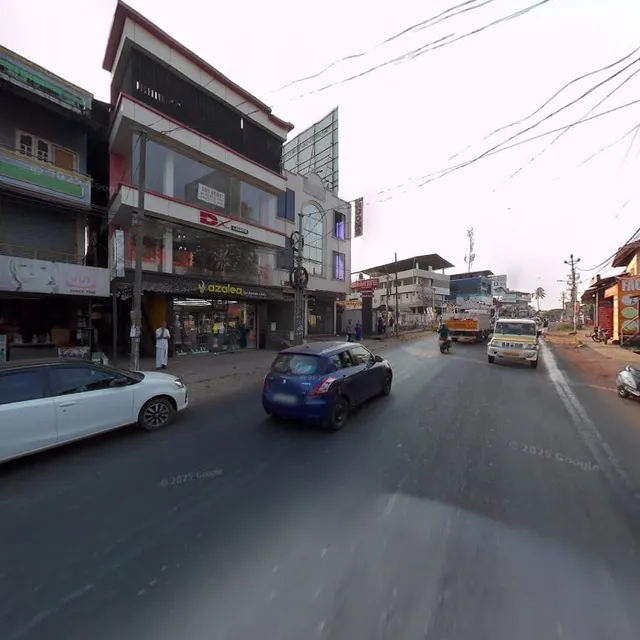 Redbell Suites Manjeri