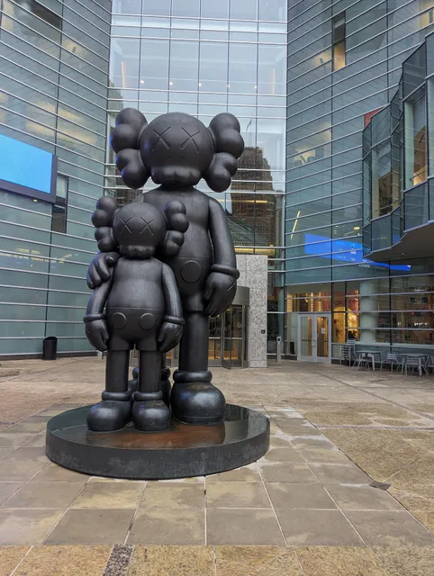 Statue “Waiting” by KAWS