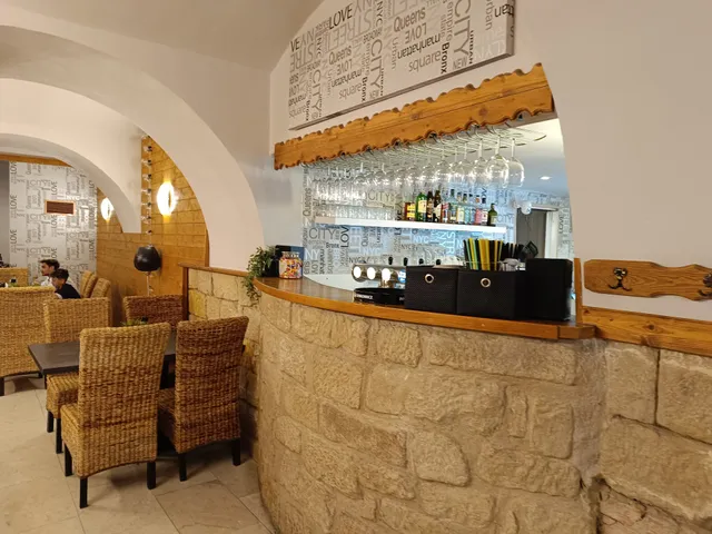 America „Pod Věží“