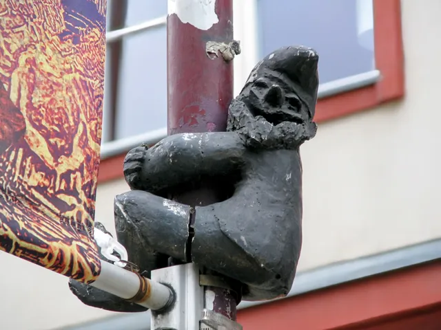 Gnome climbing lamp post