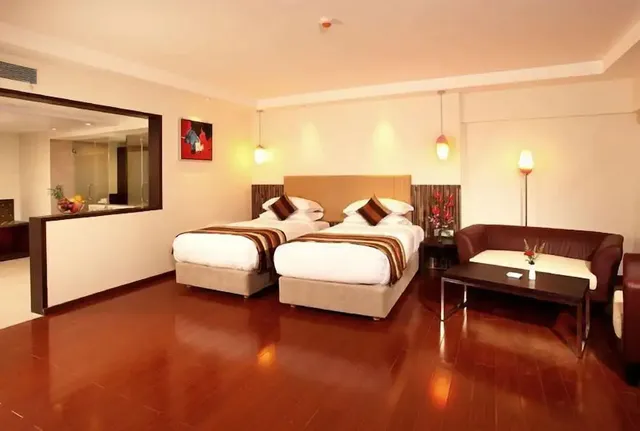 Hotel Mapple by green leavesâ