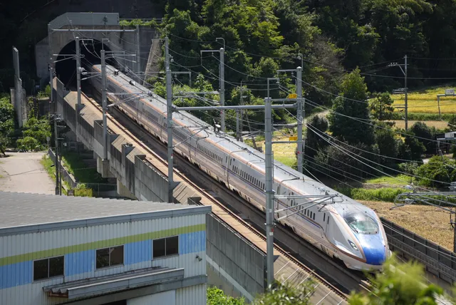 Hill park with a view of the bullet train