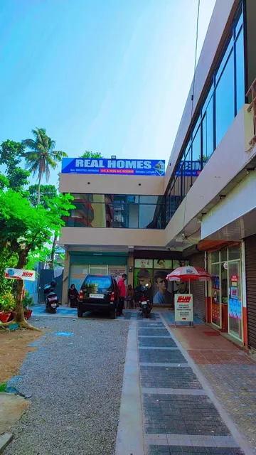 Real Homes Rooms changanacherry a/c non a/c rooms.