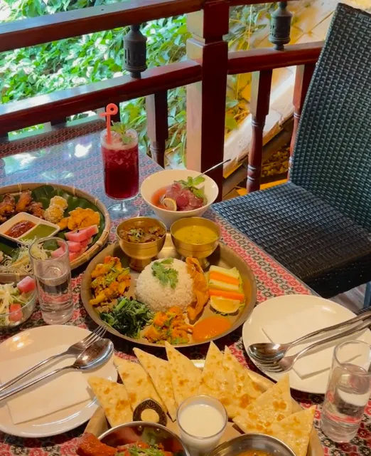 10-Year-Old Nepali Eatery—Butter Naan Dipped in Curry 