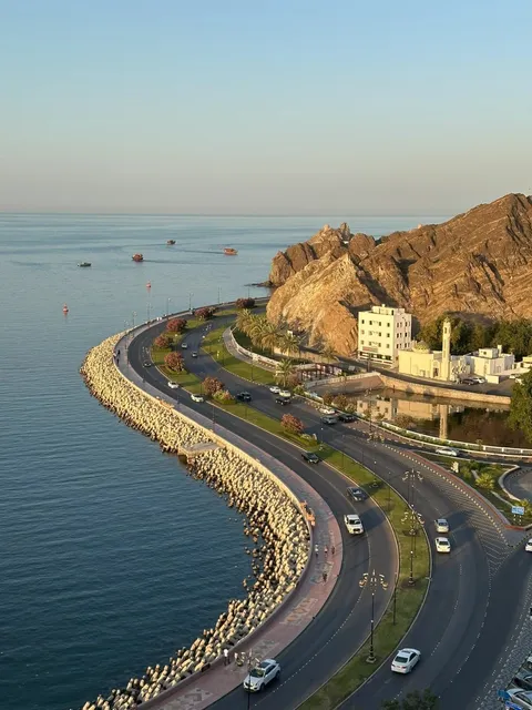🌅🌊 Muscat’s S-Curve: Where Sunset Meets History 🌊🌅