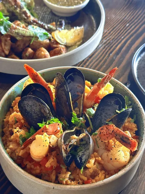 Craving Seafood Paella and Giant Octopus Legs? Dive In! 🌊🍴