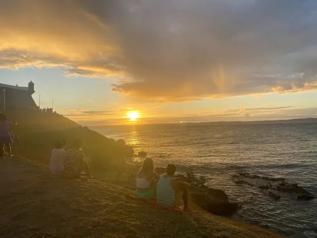 You must go and watch the sunset by the lighthouse in Salvador