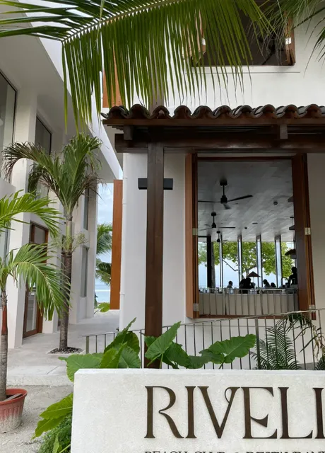 RIVELI Restaurant—Turquoise Sea & Wood Tones