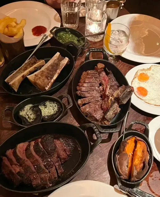 At the oldest steakhouse, indulge in hearty meat and drinks! 🥩🍻