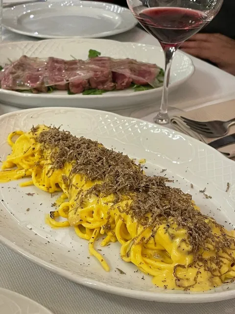 Eating steak under an ancient mural