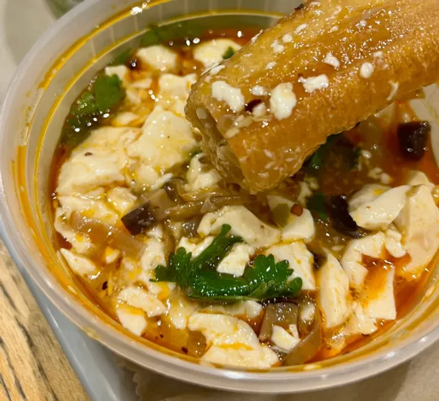 A Happy Kid Enjoying Youtiao and Doufu Nao in Manhattan😭