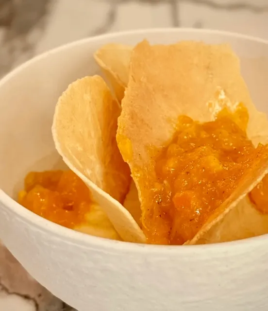 The dessert was served with a flower on top.